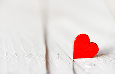 Heart on a wooden background. Background in the style of Valentine's Day. Heart on a wooden background