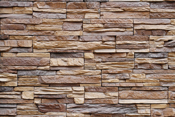 Beige facing stone as background or texture