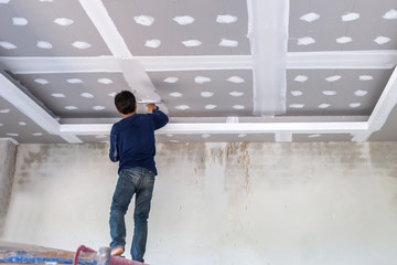 Construction man worker plaster gypsum ceiling for interior build gypsum board ceiling