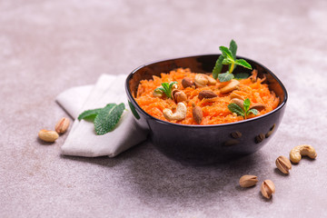Indian carrot Gajar halwa. Copyspace, horizontal view, flatlay.