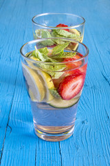 Dietary detox drink with lemon juice, strawberries and cucumber.