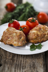 Delicious cutlets, tomatoes and parsley