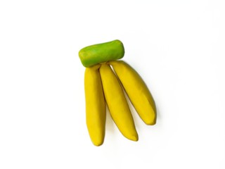 Colorful clay plasticine made are delicious banana on white background, cute fruit dough