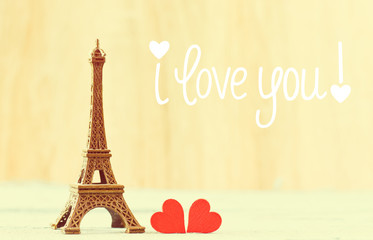 Fototapeta na wymiar Eiffel tower and red hearts - Valentine`s Day concept