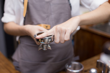 Hand of Barista made coffee at cafe. Barista prepare coffee to customer.