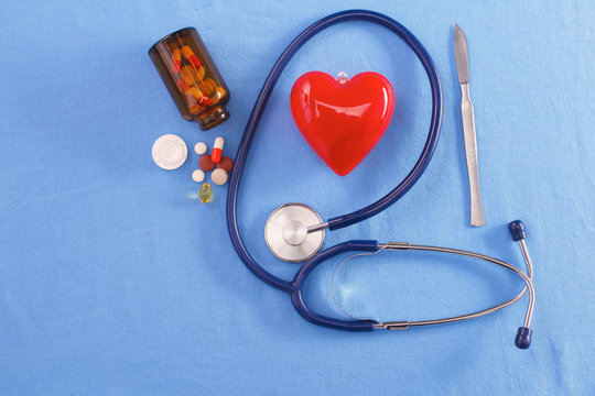 Red heart and stethoscope on a blue background
