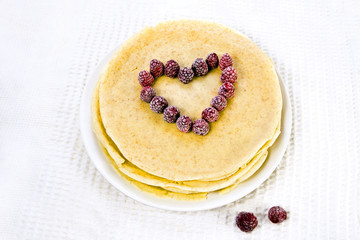 heart of raspberry on pancakes