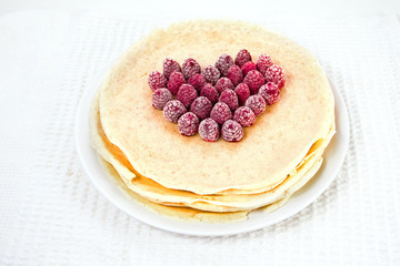 heart of raspberry on pancakes