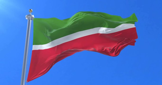 Flag of Tatarstan waving at wind in slow with blue sky, loop