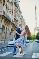 Romantic couple near the Eiffel tower in Paris