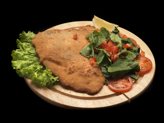 fried chicken cotoletta with tomato salad