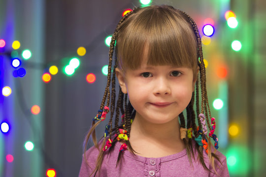 Portrait Of Pretty Little Girl With Hair Braids