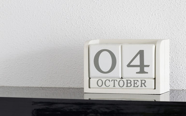 White block calendar present date 4 and month October