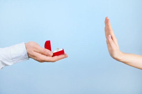 Engagement / Marriage / Wedding Proposal Refusing / Rejection / Not Accepting Scene. Close Up Of Man Handing The Expensive Gold Platinum Diamond Ring To His Bride.