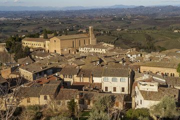 Fototapeta na wymiar Aerial view of San Gimignano and the Church of Sant'Agostino in the afternoon light, Siena, Tuscany, Italy