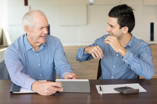 Excited Business Partners Discussing Work Issues