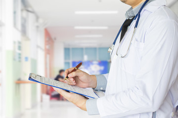 Health care, emergency room physician Writing a patient illness report.