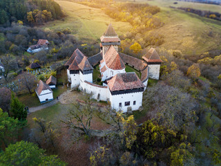 Viscri saxon church in the traditional village of Viscri, Romania. UNESCO site. - obrazy, fototapety, plakaty