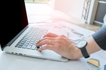 Close up. Man Working on laptop connecting networking Concept,With sunset,Selective Focus.