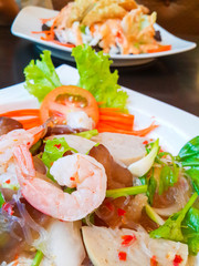 Thai cuisine spicy pork salad or Pork salad spicy ,shrimp, lettuce, chili tasty, thai food on table..