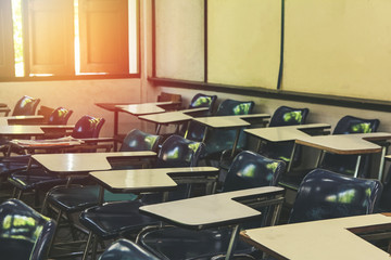 Classroom in background without ,No student or teacher . with Sunset limelight  near window.