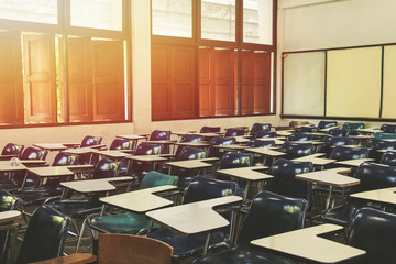 Classroom in background without ,No student or teacher . with Sunset limelight  near window.