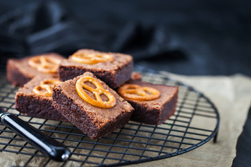 Homemade chocolate brownies with salted pretzels on top
