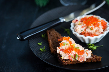 Salmon pate  with red caviar served with sliced bread