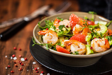 Delicious fresh salad with prawns, grapefruit, avocado, cucumber