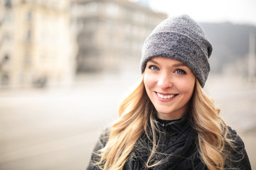 Smiling blonde woman with blue eyes