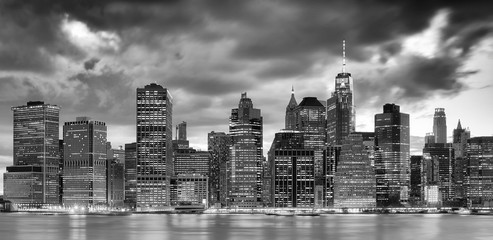 Black and white panoramic picture of the New York City skyline at dusk, USA.