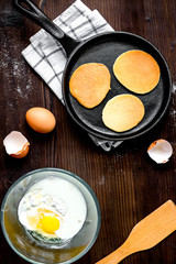 cooking pancake on wooden background top view ingredients for ma