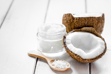 coconut oil for body care in cosmetic concept on white desk mock