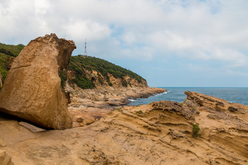Sea cliff with a wave-cut platform at Yehliu Geopark, Taipei, Taiwan.