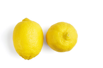 Two yellow ripe lemon fruit, isolated on a white background, top view