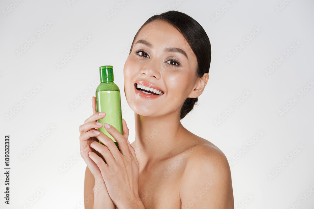 Canvas Prints beauty portrait of smiling woman with soft healthy skin smiling and holding makeup remover, isolated