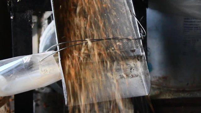 The machine is grinding corn into flour
