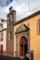 San Cristobal de La Laguna, Tenerife, Spain - December 7, 2017: View of street an church Iglesia Nuestra Senora De Los Dolores .