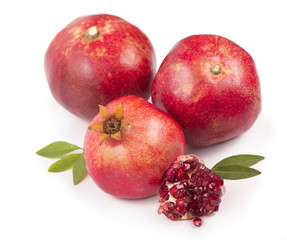 Pomegranate fruit with slice isolated on white background.