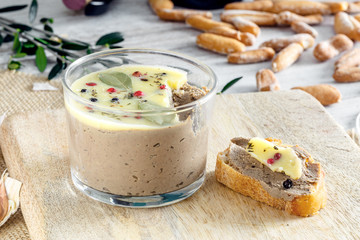 Chicken liver pate jar covered with melted butter