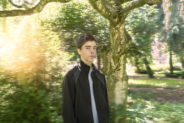 Portrait of a young man in a dreamy garden
