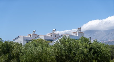 three greek vacation homes and landscape