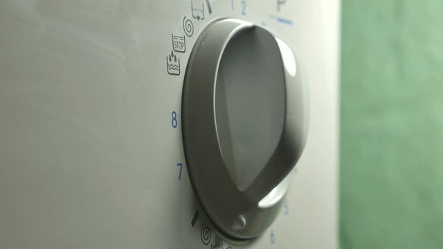 Washing machine. Setting Program On A Washing Machine Close Up, broken.