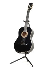Naklejka premium Black classical guitar with on a guitar stand isolated on white background.