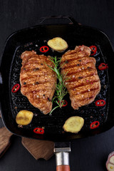 Grilled pork steak in grill pan