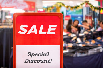Red Special Discount Sale Sign in the Shopping Mall during the Holidays.