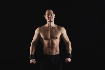 Obraz na płótnie Canvas Strong athletic man showes naked muscular body