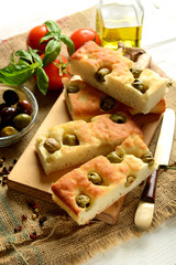 traditional Italian focaccia with olives on the table