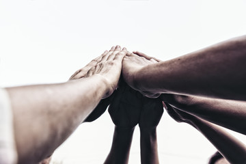 People hand assemble as a connection meeting teamwork concept. Group of people assembly hands as a business or work achievement. Man and women touch each other hand outdoor. Teamwork conceptual.