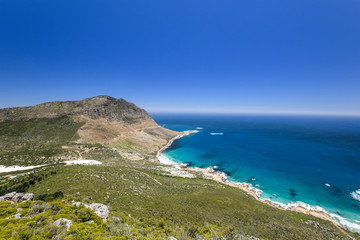 Fototapeta na wymiar Stunning wide angle panoramic view of Sandy Bay Beach near Llandudno and Hout Bay, little towns in the Cape Town area, South Africa, seen from the summit of Little Lion's Head Mountain.